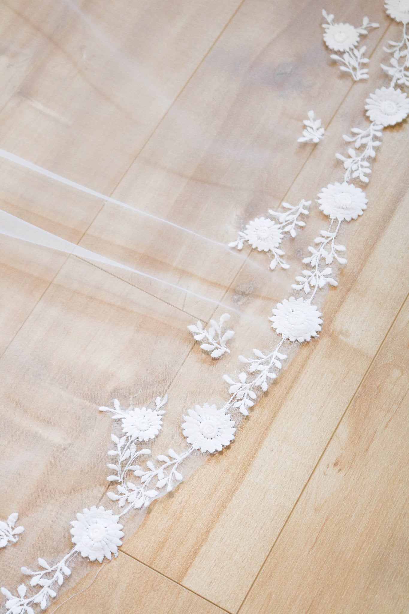 A close up of the floral vine lace pattern on Sienna wedding veil trim. Canadian weddings. Wedding Canada. Wedding veils Canada. Bridal Hair Accessories. Bridal Accessories. Canadian Bridal Accessories. Handmade Canadian Accessories. Canadian handmade Accessories. Canadian designer. Canadian artist.