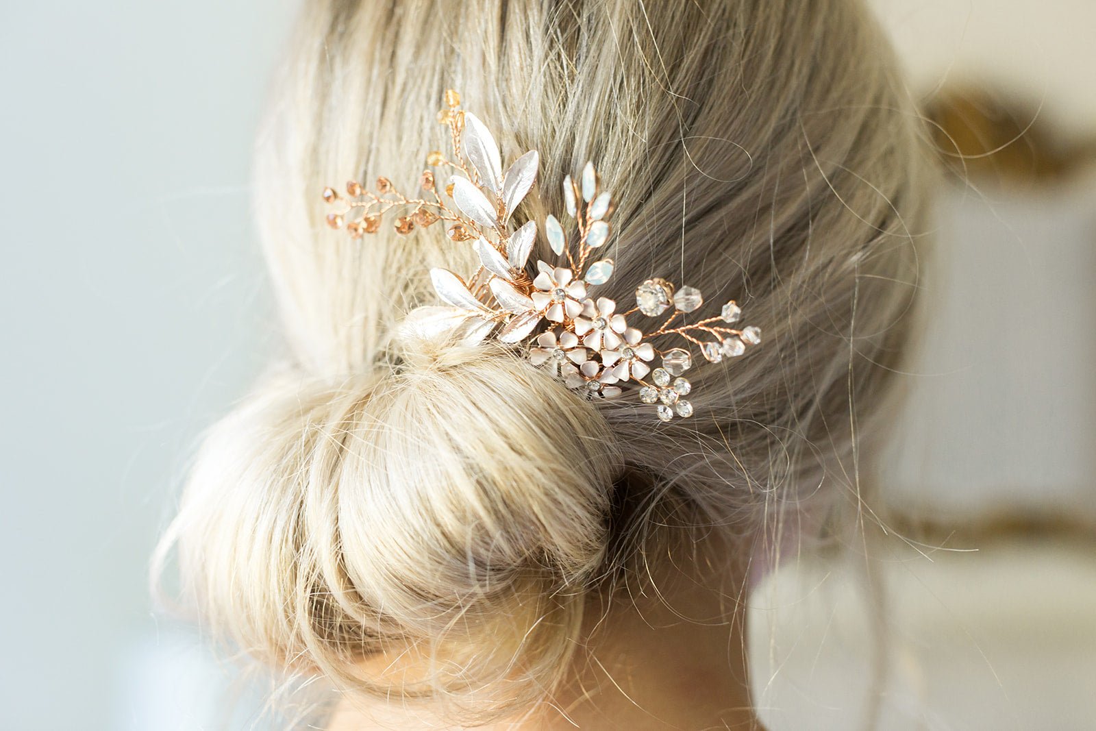 A close up of the rose gold Summer Bloom Bridal Comb with crystals tucked in a bridal bun. Bridal Hair Accessories. Bridal Accessories. Canadian Bridal Accessories. Handmade Canadian Accessories. Canadian handmade Accessories. Canadian weddings. Wedding Canada.
