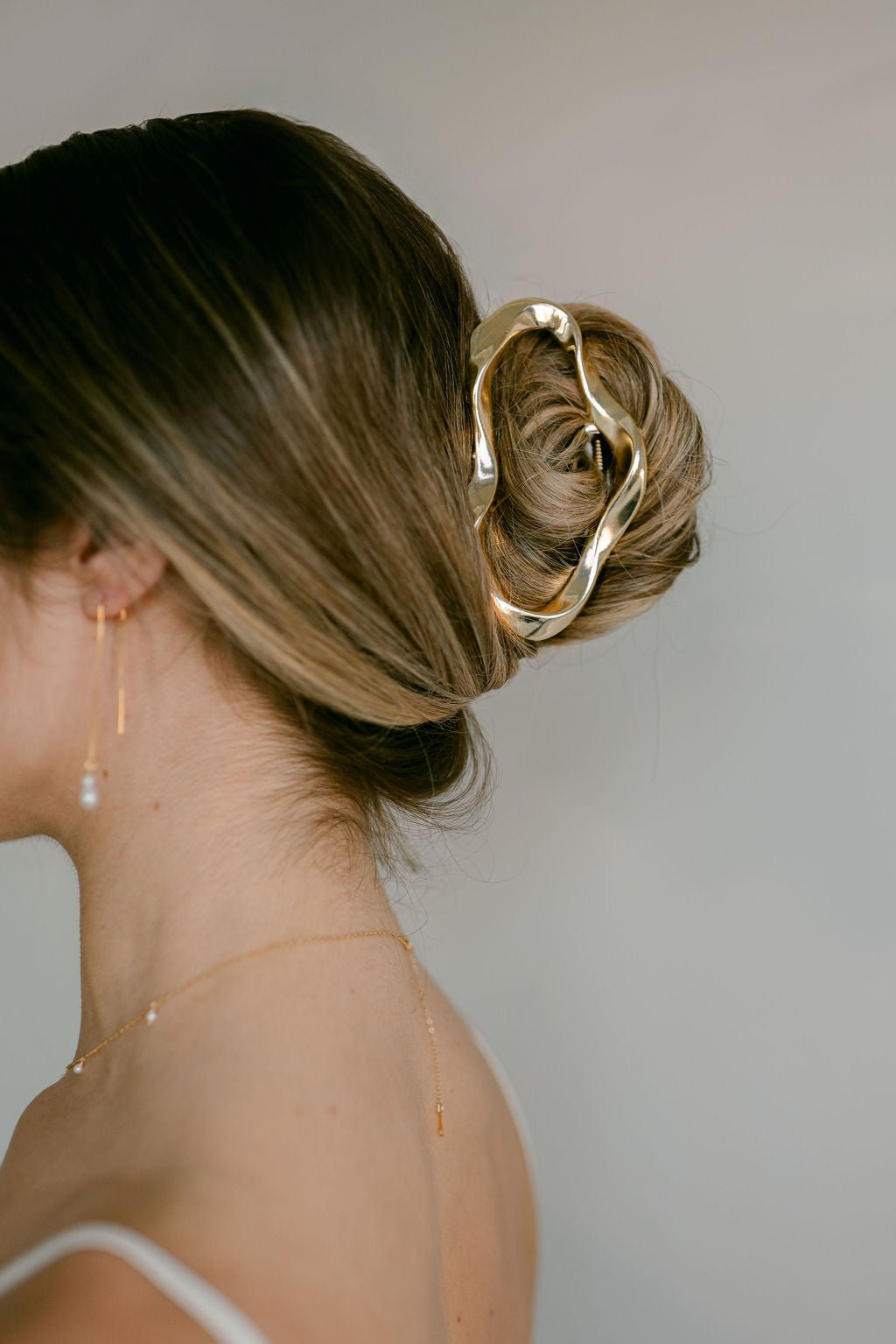 Styled bun with gold claw clip. Hair Accessories Canada. Bridal Hair Accessories. Canadian jewelry business.