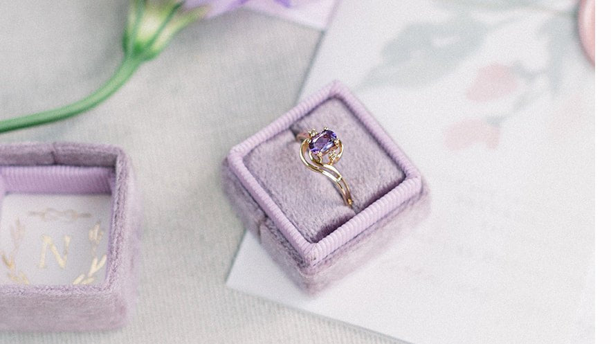 The Viola Diamond and Amethyst Vintage Engagement Ring in 10k Yellow Gold c.1920s in a purple square ring box. Antique Engagement Rings Canada. Canadian vintage engagement rings. Vintage engagement rings Canada. Bridal jewelry Canada. Canadian weddings. Wedding Canada. Canadian jewelry brands. Affordable Canadian jewelry brands. Canadian bridal jewelry. Woman-owned Canadian jewelry brand. Pearl jewelry Canada. Pearl Bridal jewelry Canada. Organic pearl jewelry.