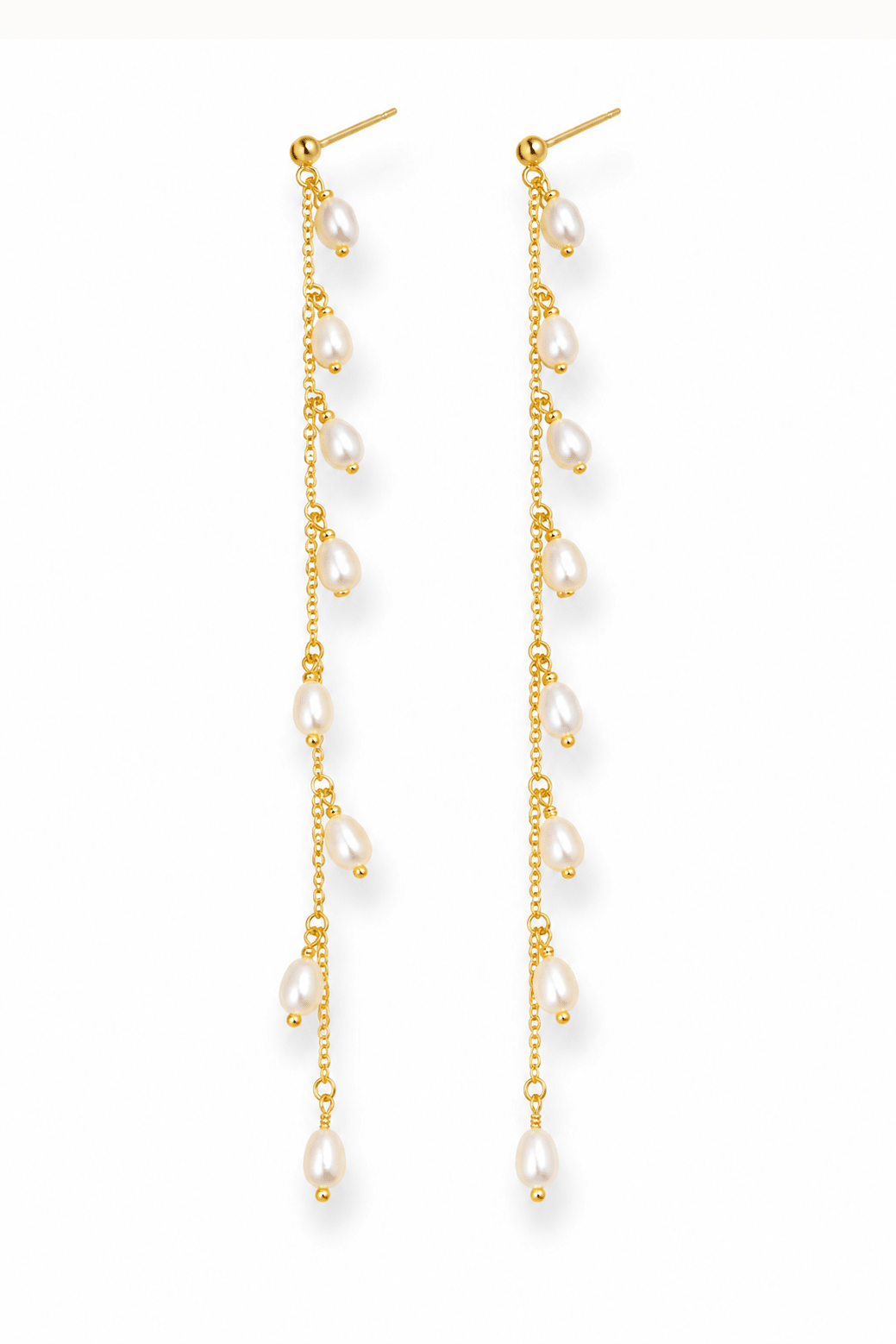 Pair of fresh water pearl drop dangle earrings with gold filled chains on a white background. Handmade pearl jewellery by BIPOC jewelry designer