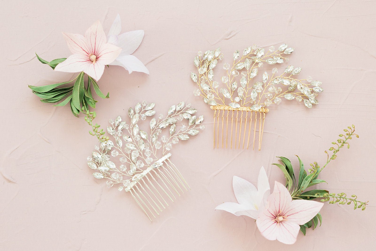 Silver and Gold Crystal Bridal Hair Combs and flowers on pale pink surface. Bridal Hair Accessories, Canadian Bridal Accessories, & Handmade Canadian Accessories by BIPOC wedding designer