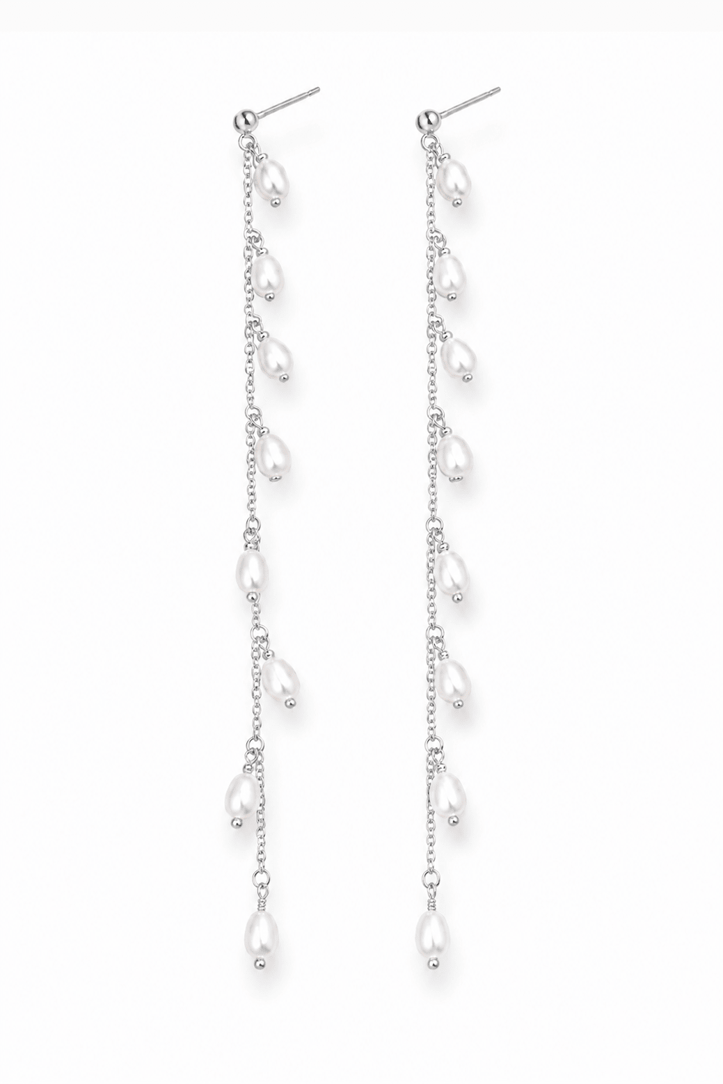 Pair of long sterling silver fresh water pearl dangle earrings on a white background. Handmade pearl jewelry Canada