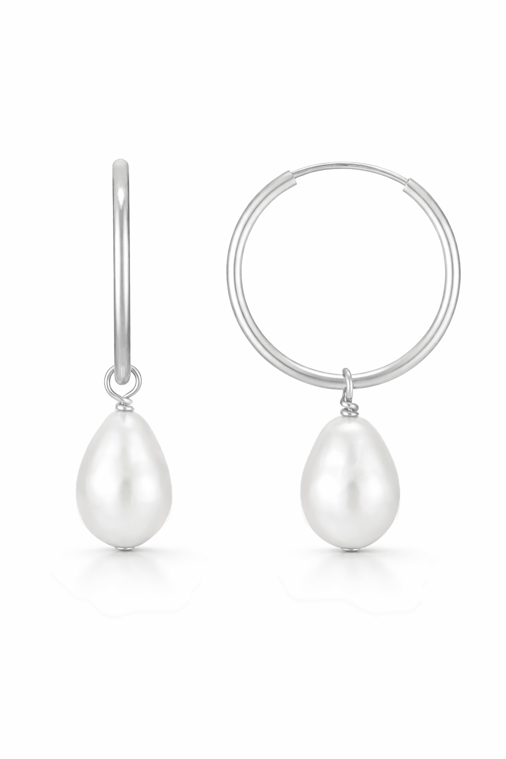 Pair of freshwater pearl s suspended on a sterling silver hoop, on a white background. Everyday pearl earrings handmade in canada