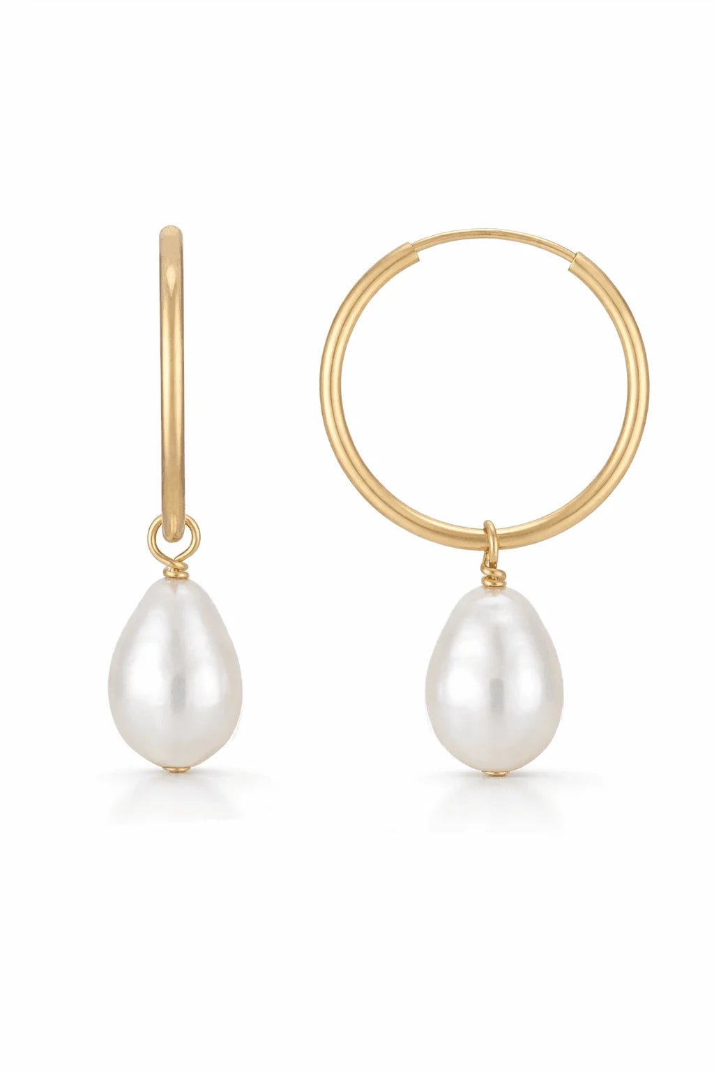 Gold filled hoop earrings with white freshwater pearls on a white background. Minimalist jewelry, Everyday jewelry, & Gold-filled Canadian jewelry handmade by Canadian jewelry designer