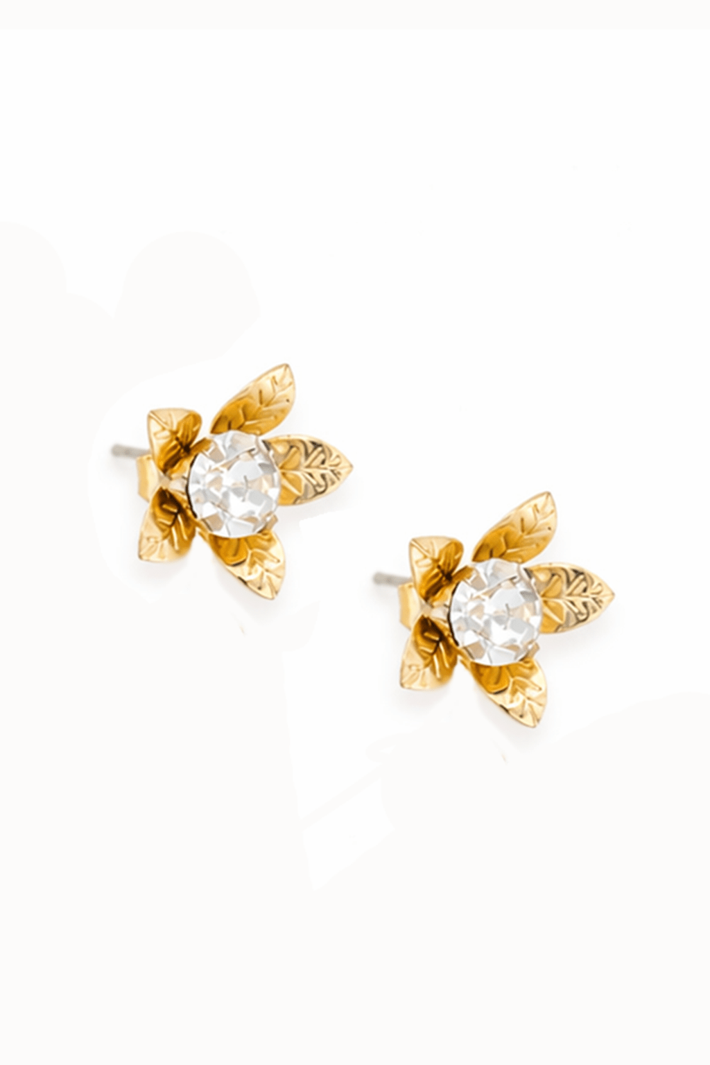 Gold floral earrings with clear gemstones on a white background, made in canada