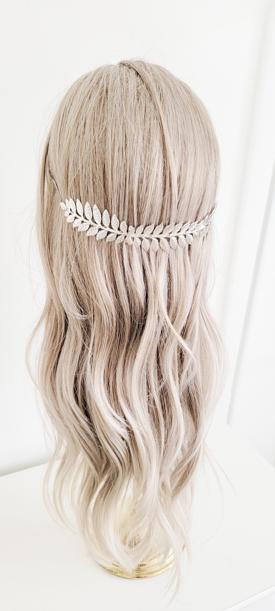 Silver laurel leaf bridal headband set in cascading waves.