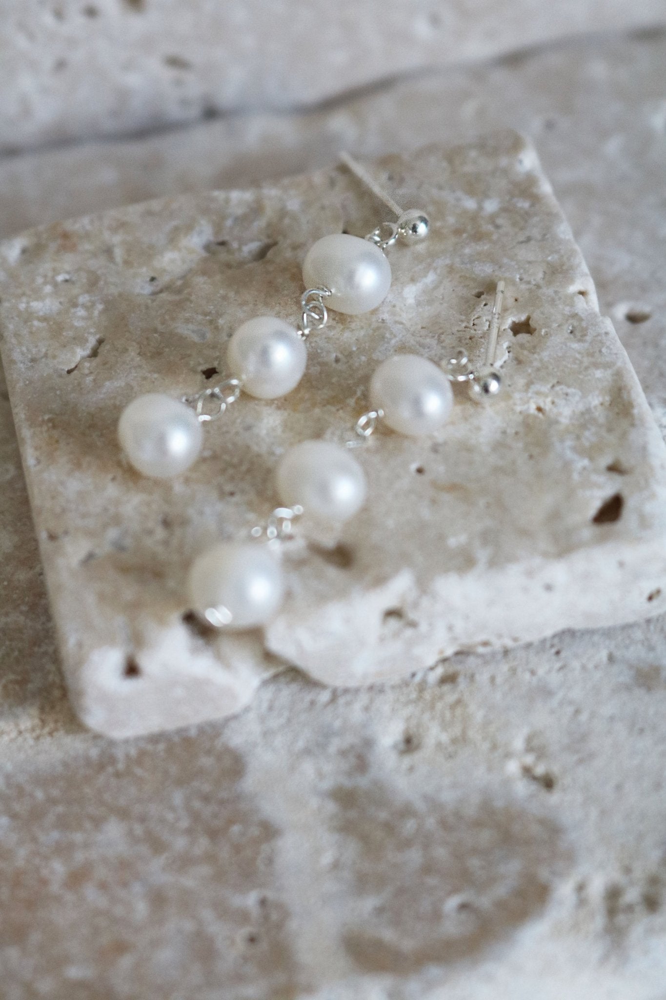 Sterling Silver Isla Drop Fresh Water Pearl Studs for Wedding on a Stone Display.