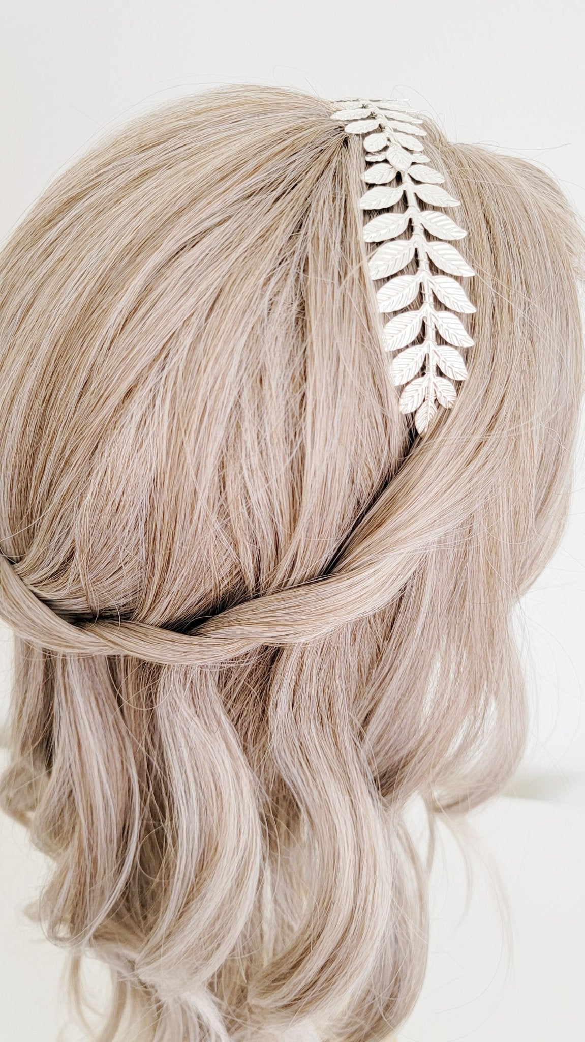 Silver wire-wrapped laurel leaf headband in bridal hair. 