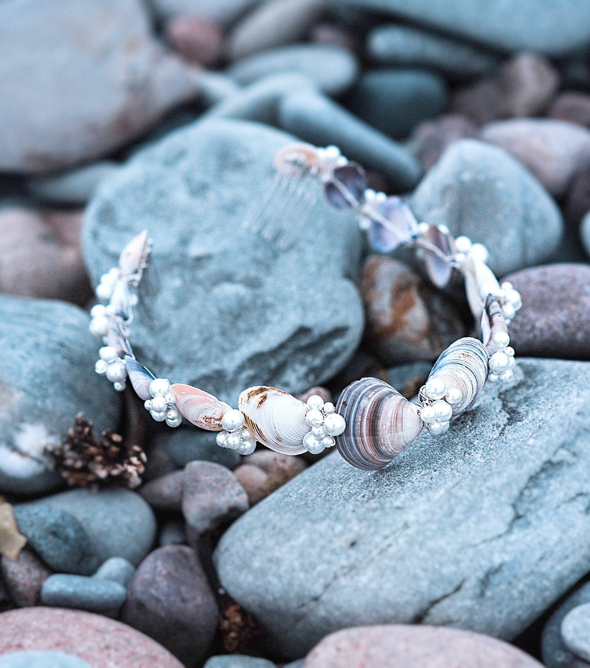 Ocean inspired hair wreath combines seashells with organic freshwater pearls for a lasting impression. 