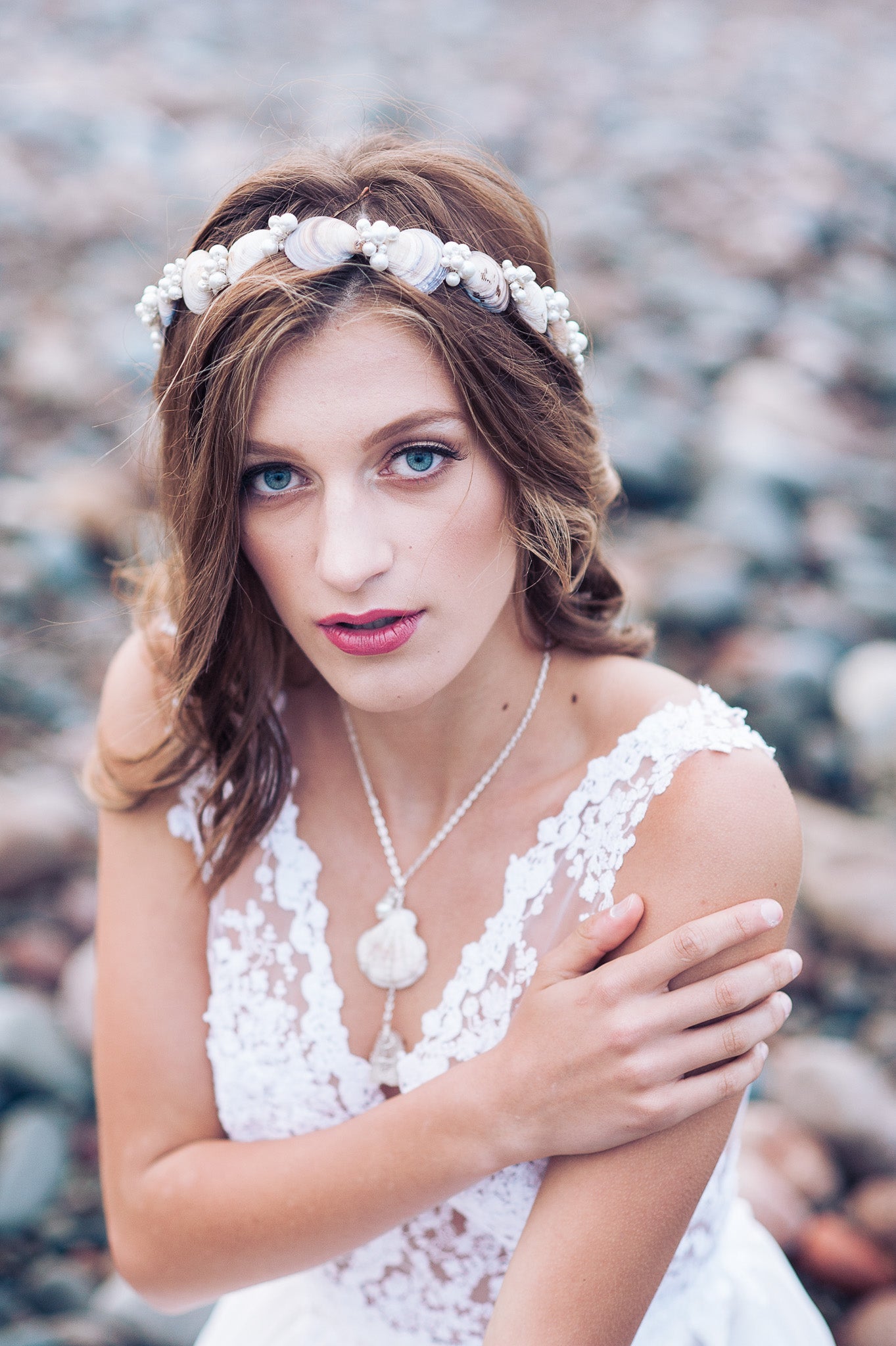 Seashell and pearl bridal set - hair wreath and shell pearl drop necklace worn by a beach bride among the rocks. 