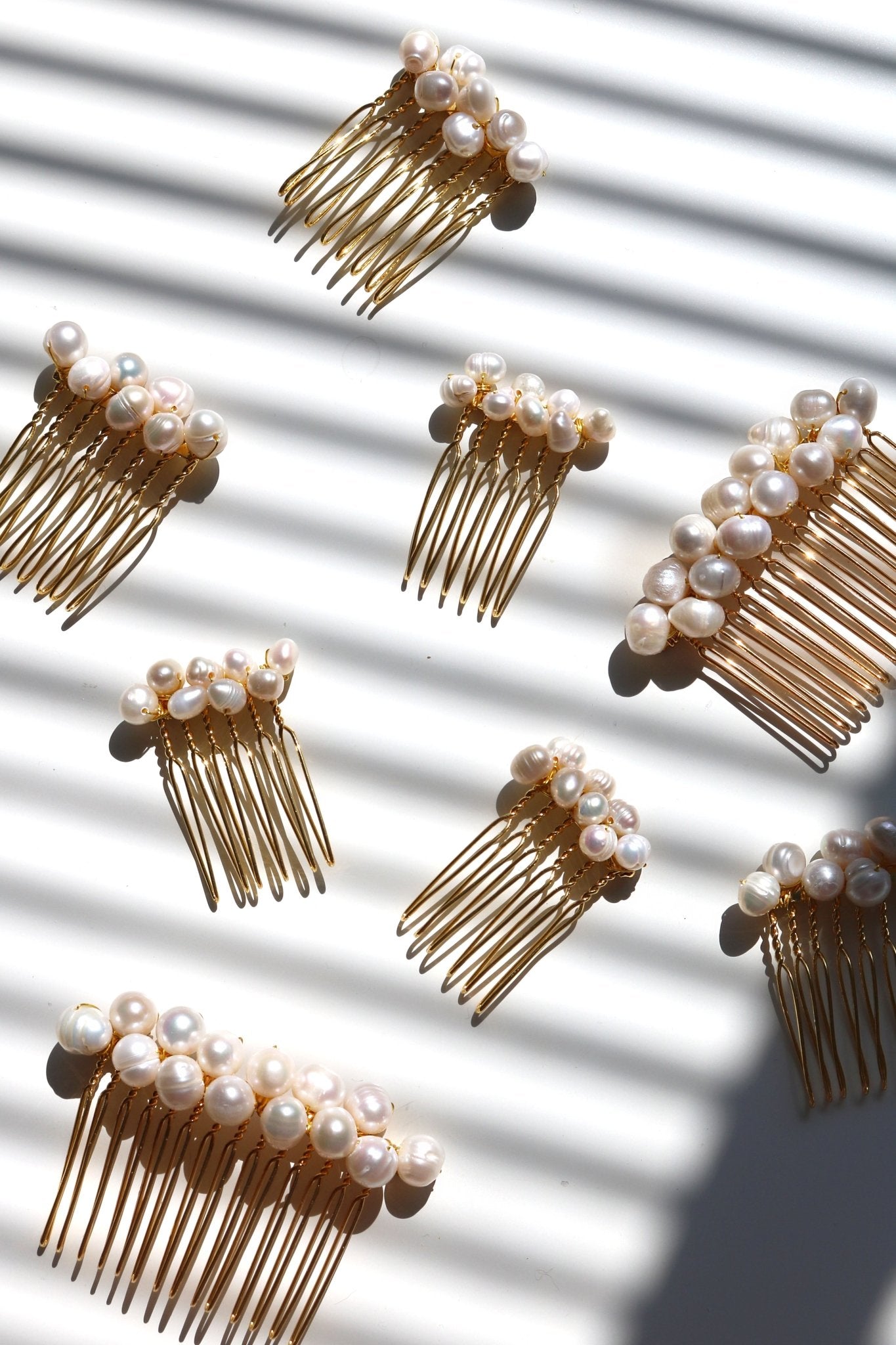 Set of 3 golden hair combs with clustered freshwater pearls. 