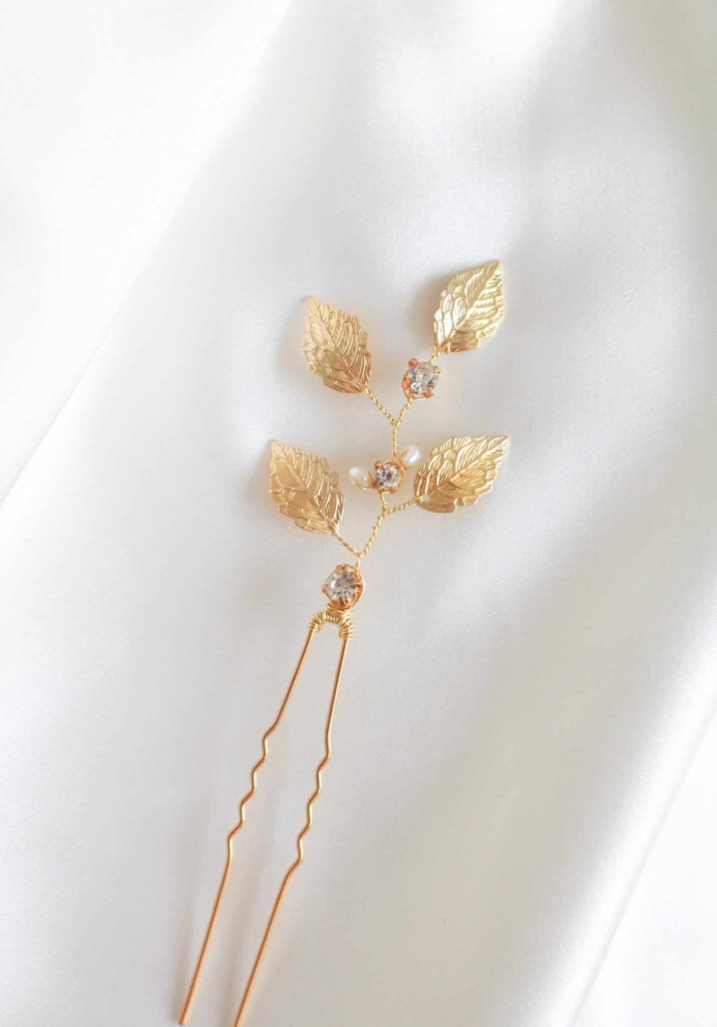 Golden leaf bridal hairpin with crystals and freshwater pearls.