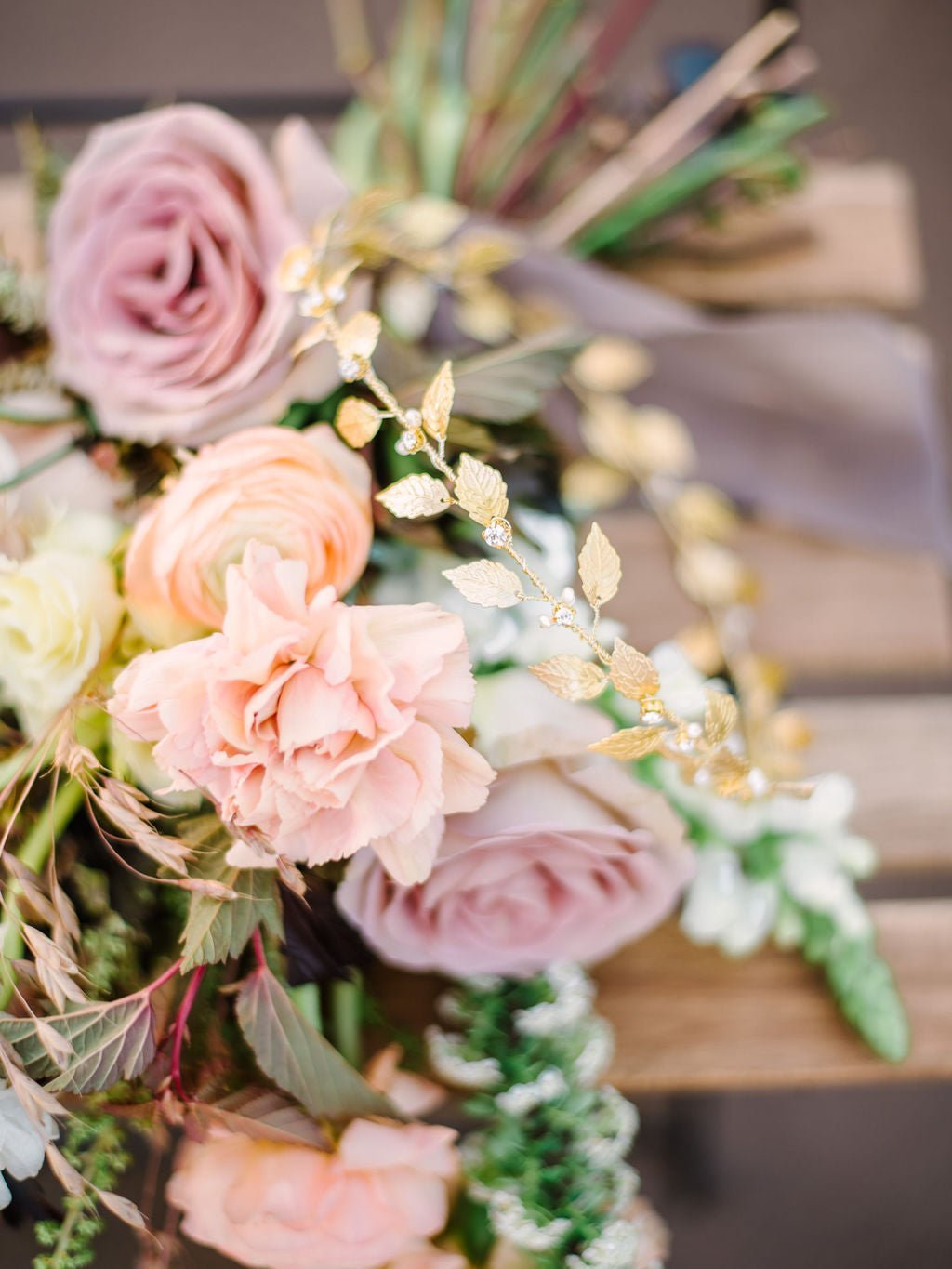 Aelia Leaf and Fresh Water Pearl Crystal Hair Circlet nestled in bridal bouquet. 