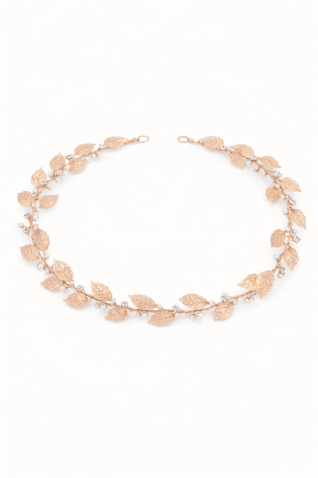 Rose gold leaf hairvine with freshwater pearls and crystals on a white background. Bridal hair accessories handmade in Canada by BIPOC bridal designer