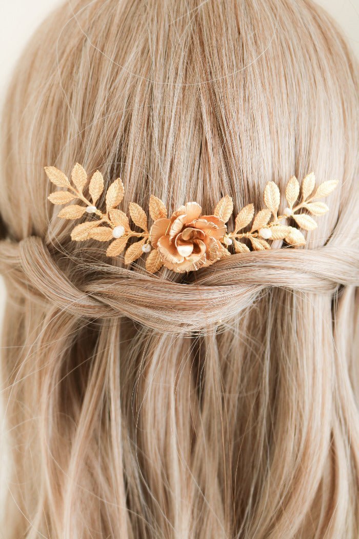 Elegant Belle Floral hair comb with Fresh Water Pearls tucked into a braided bridal hairstyle.