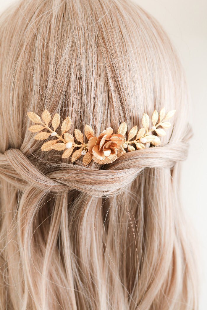 Blonde hair with a decorative gold floral bridal hairpiece. Bridal hair accessories & Canadian bridal accessories handmade by Woman-owned Canadian jewelry brand