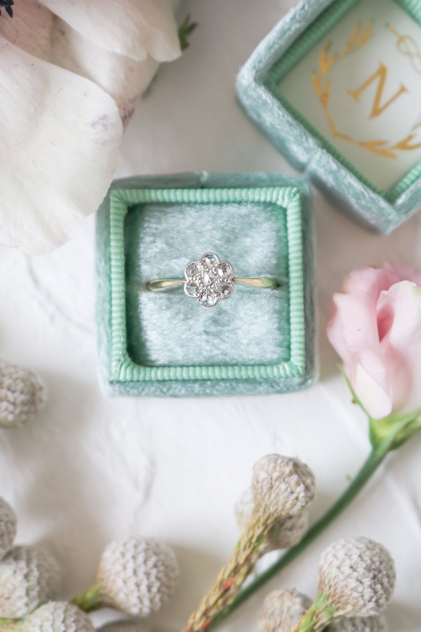 Betony Diamond Flower Vintage Engagement Ring in 18ct Yellow Gold and Platinum sitting in a ring box.