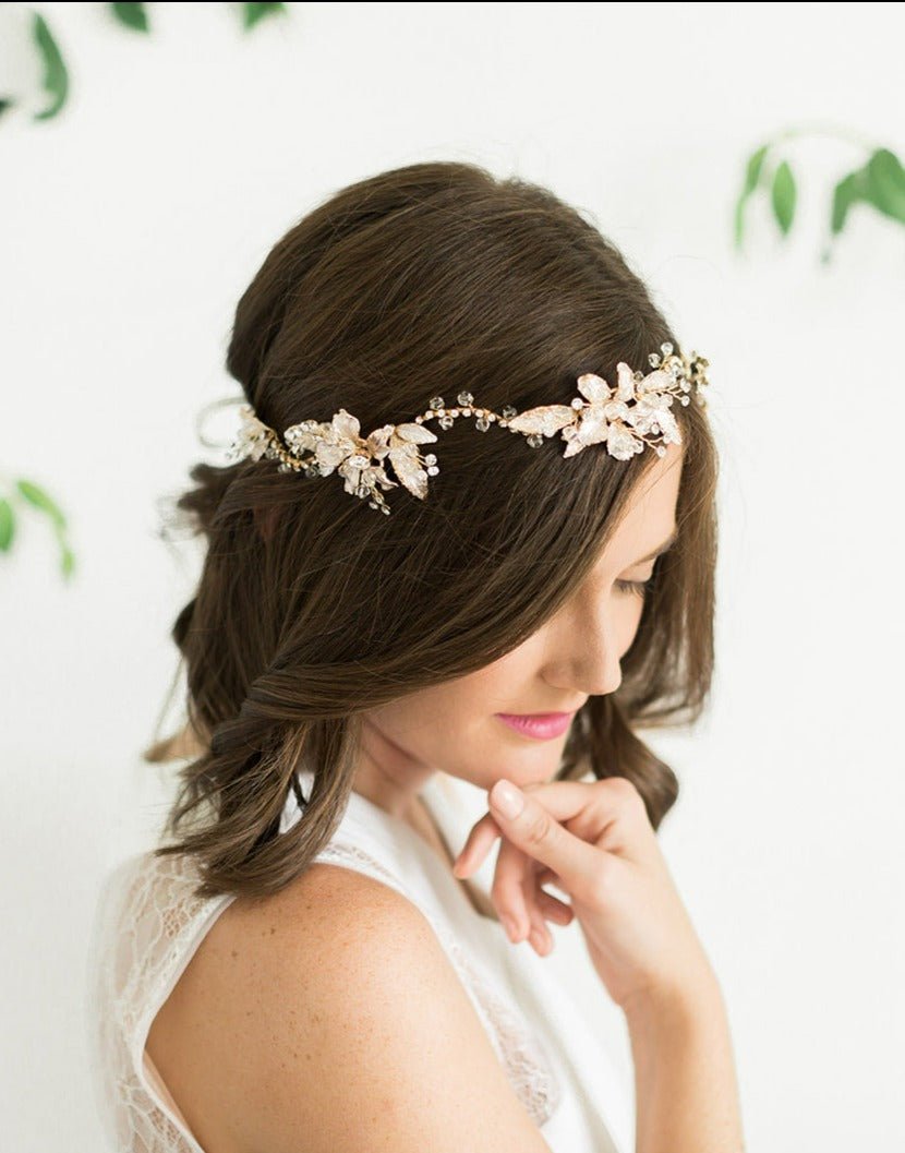 A bride is delicately adorned with this whimsical gold and crystal bridal hairvine with leaves and flowers. Bridal Hair Accessories. Bridal Accessories. Canadian Bridal Accessories. Handmade Canadian Accessories. Canadian handmade Accessories. Canadian weddings. Wedding Canada. 