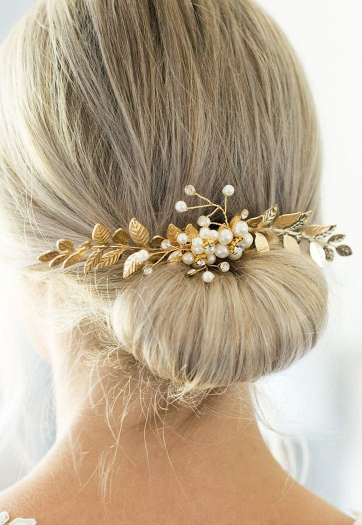 Calanthe Leaf and Crystal Freshwater Pearl Comb tucked into a blonde bridal bun. Bridal Hair Accessories. Bridal Accessories. Canadian Bridal Accessories. Handmade Canadian Accessories. Canadian handmade Accessories. Canadian weddings. Wedding Canada. Organic pearl accessories. Pearl Bridal Hair Accessories. Pearl Bridal Accessories.