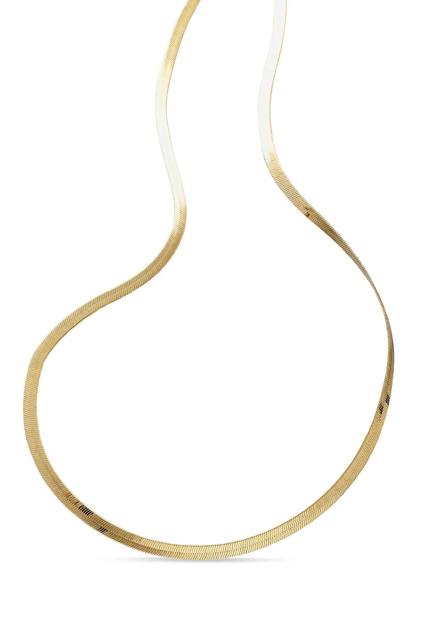 A thick gold-filled herringbone necklace laid out on a plain white background. Everyday jewelry, minimalist jewelry, & Gold-filled Canadian jewelry handmade by small Canadian jewelry brand