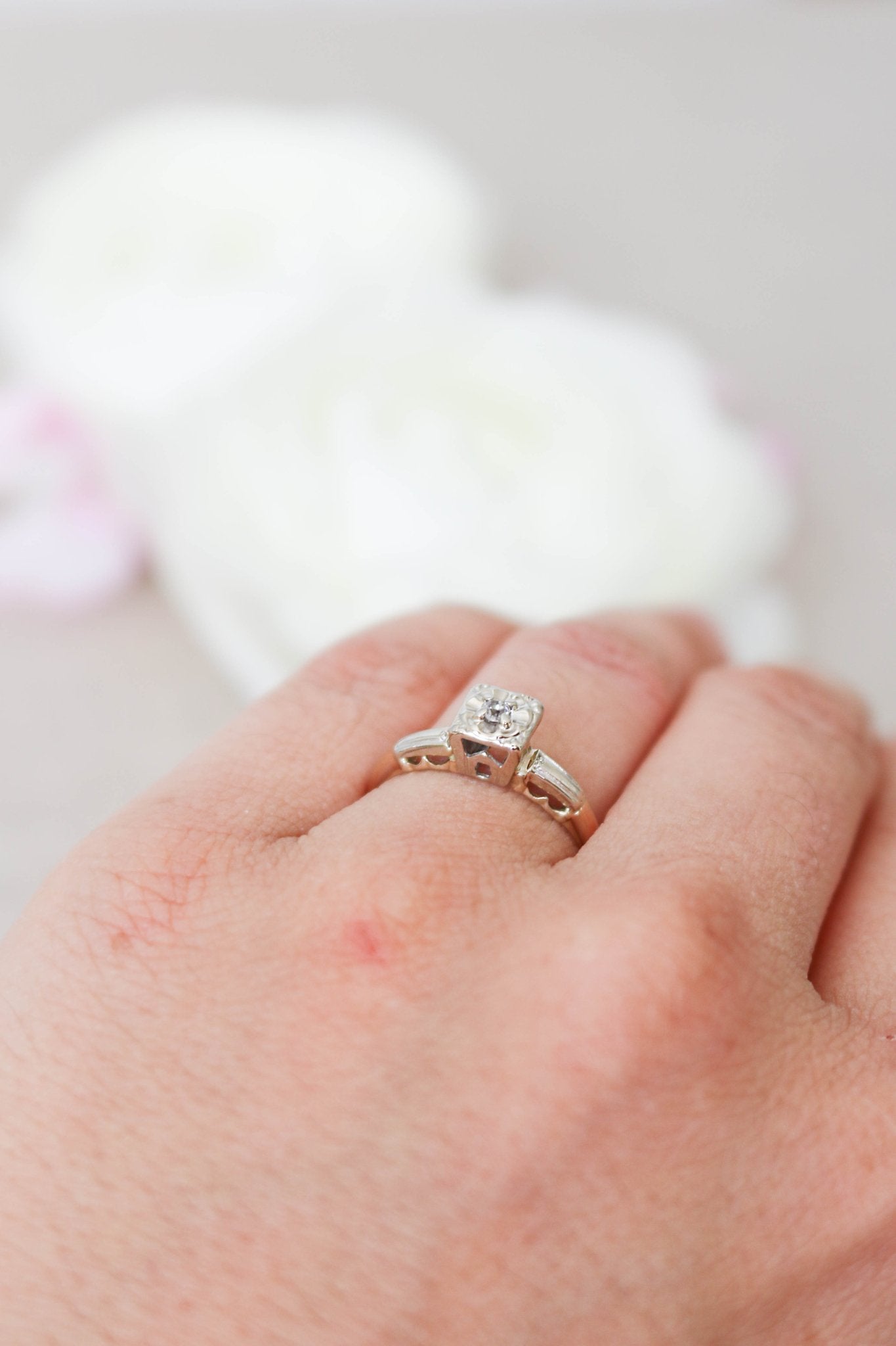 Vintage Engagement Ring in 14ct Gold with Diamond is shown worn on a ring finger. 