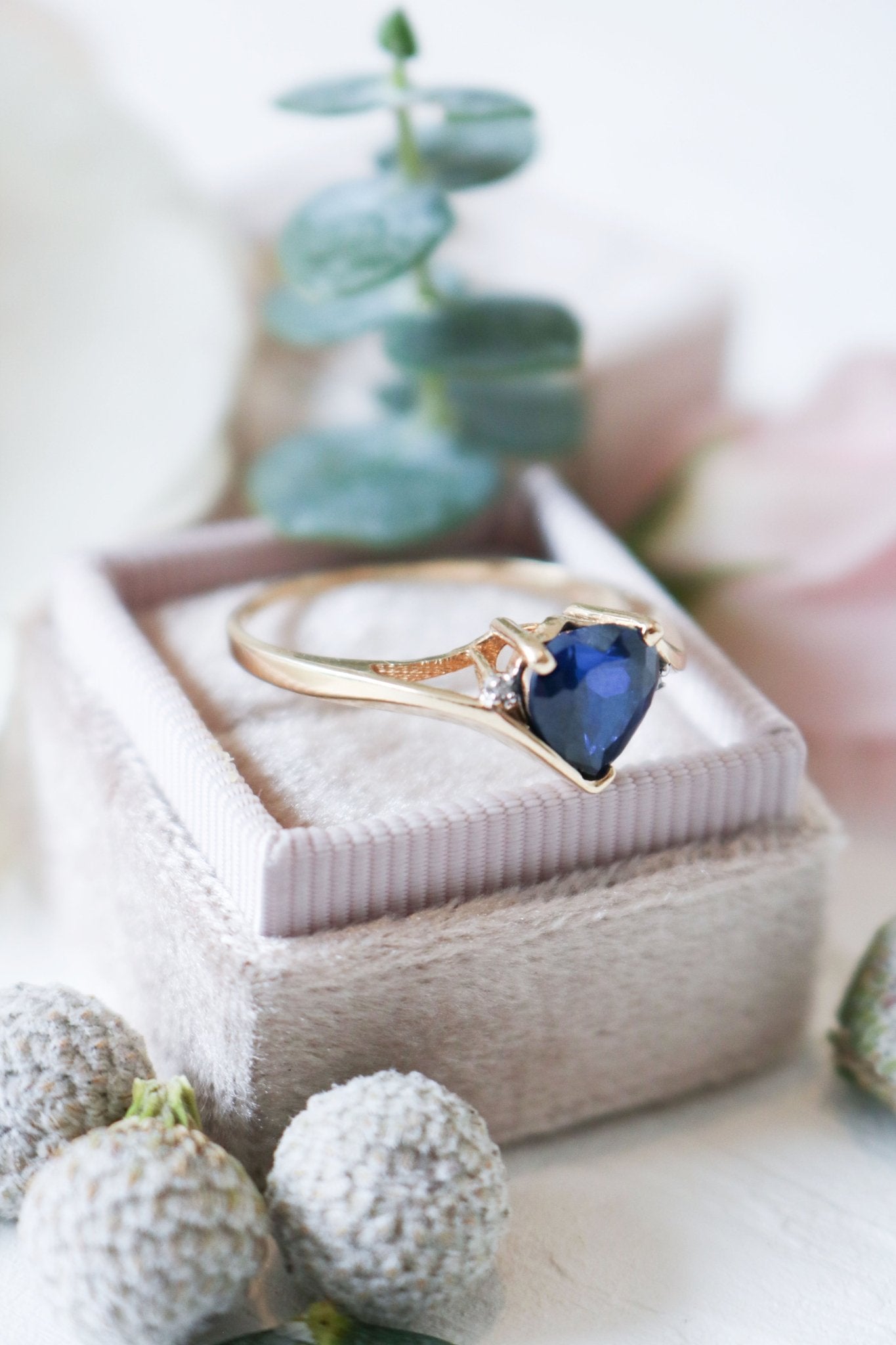 Angled close up of the Celia Sapphire Heart and Diamond Vintage Engagement Ring in 9ct Gold.