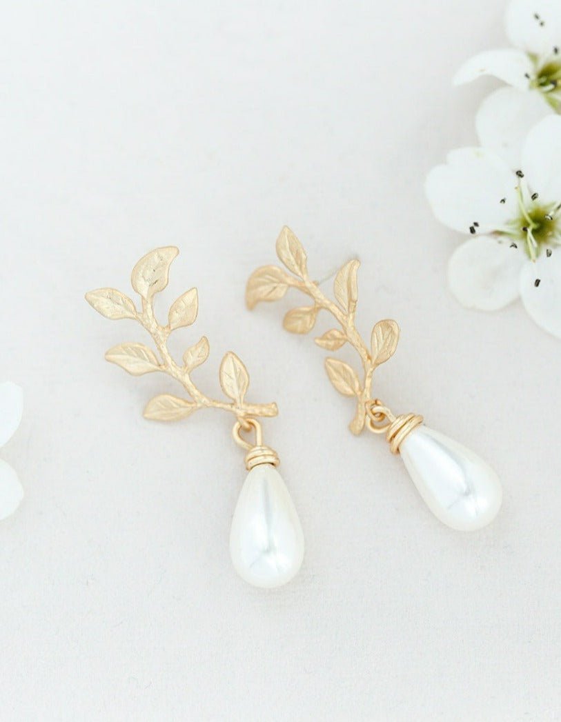 Gold-filled freshwater drop pearl earrings against white backdrop. 