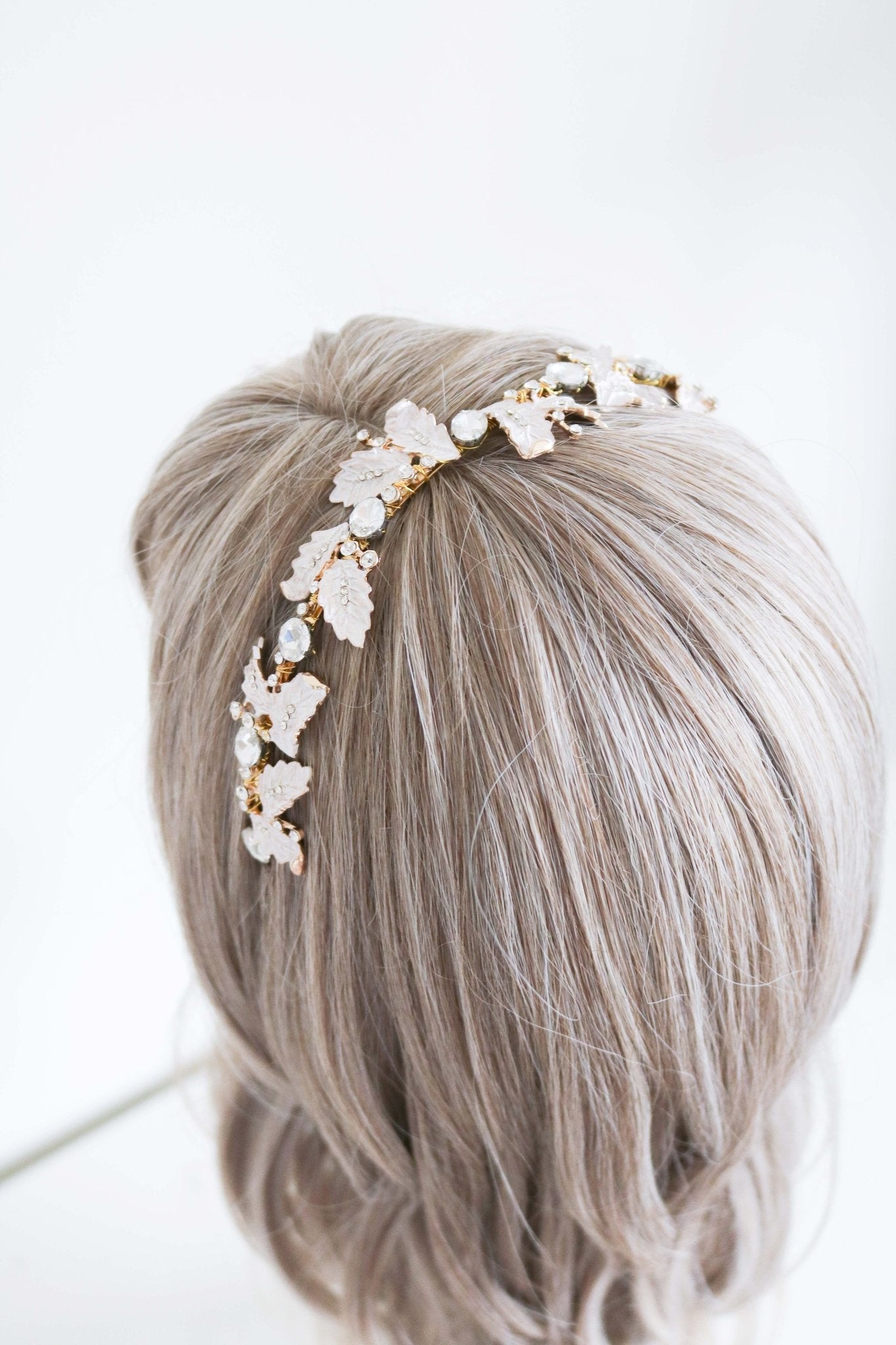 Gold and crystal headband with leaves for wedding day. 