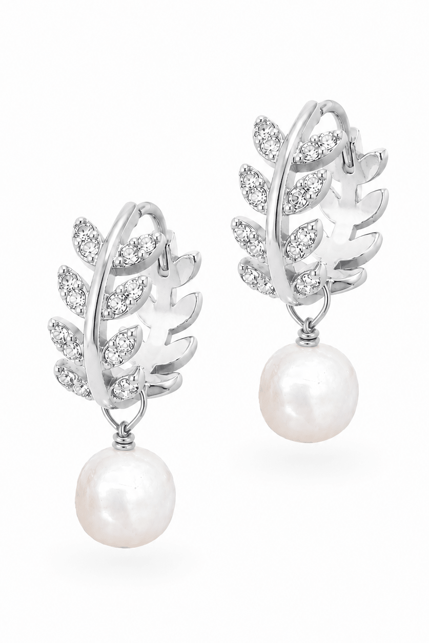 Pair of sterling silver laurel leaf hoop earrings with fresh water pearl drops on a white background. Handmade earrings by Canadian jewellery designer