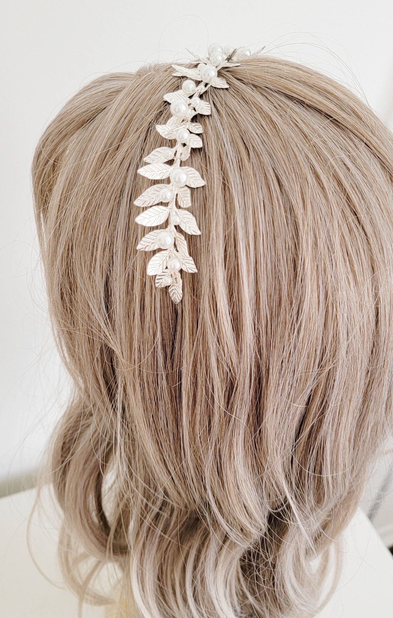 Full silver laurel leaf headband with pearls for wedding day.