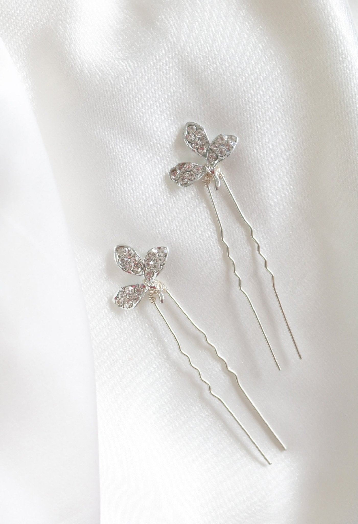 Two silver crystal leaf hairpins for brides.