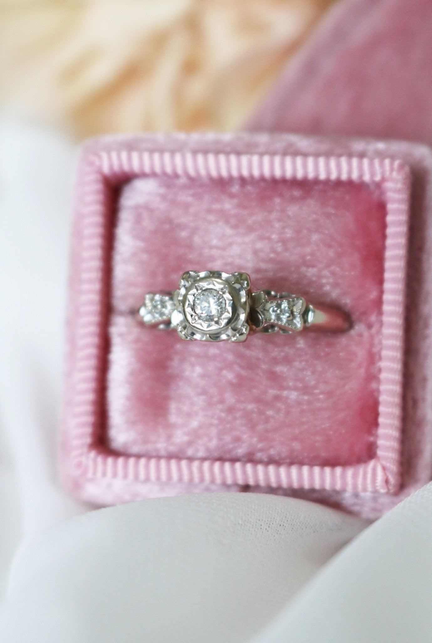 A 14k White Gold Vintage Diamond Engagement Ring in a pink ring box. Canadian vintage engagement rings. Bridal jewelry Canada. Wedding Canada. Small Canadian jewelry brands. Canadian bridal jewelry. Antique Engagement Ring. Woman-owned Canadian jewelry brand. Canadian jewelry business.