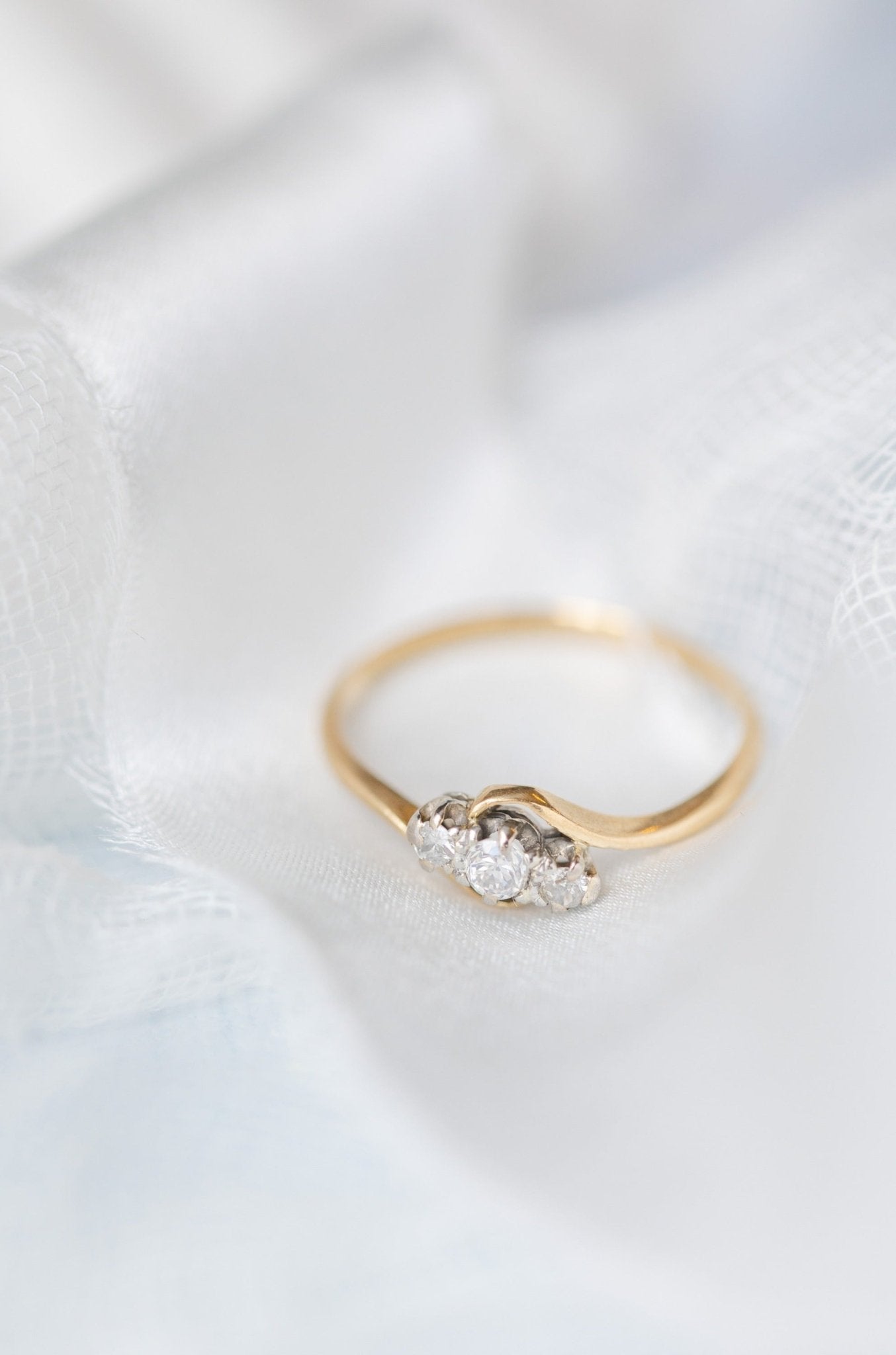 18ct Gold and Platinum Diamond Vintage Engagement Ring on a white backdrop. 