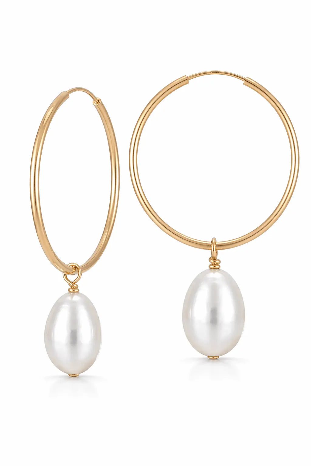 Gold filled thin hoop earrings with white freshwater pearls on a white background. Gold-filled jewelry & pearl hoop earrings handmade in Canada by BIPOC jewelry designer