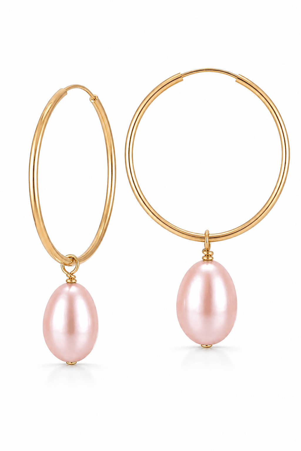 Gold hoop earrings with blush pink fresh water pearls on a white background. Handmade pearl earrings by Canadian jewellery designer