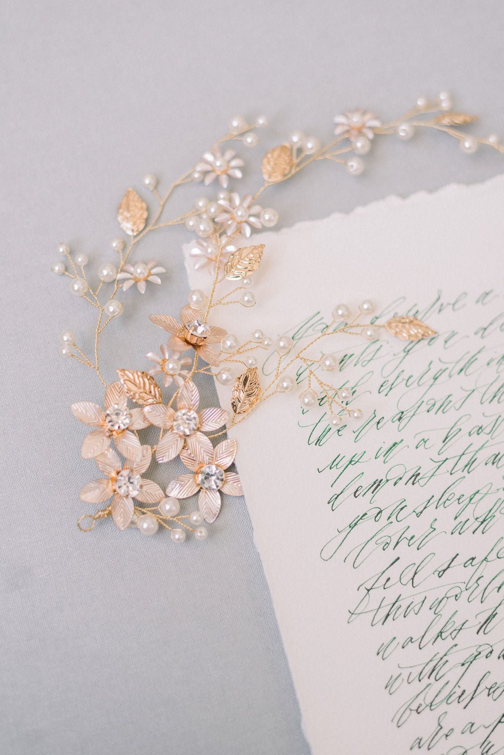 Complex gold bridal hairpiece with freshwater pearls, crystals, and flowers. 