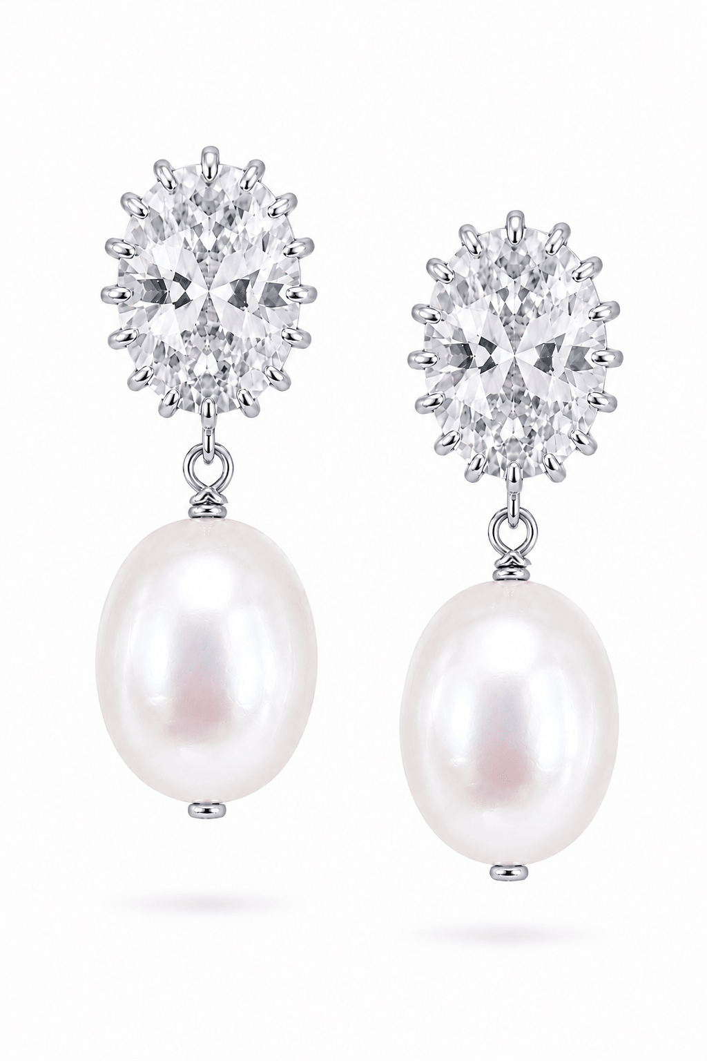 Fresh water pearl drop earrings with cubic zirconia crystal tops on a white background.  Handmade pearl jewellery by BIPOC jewelry designer