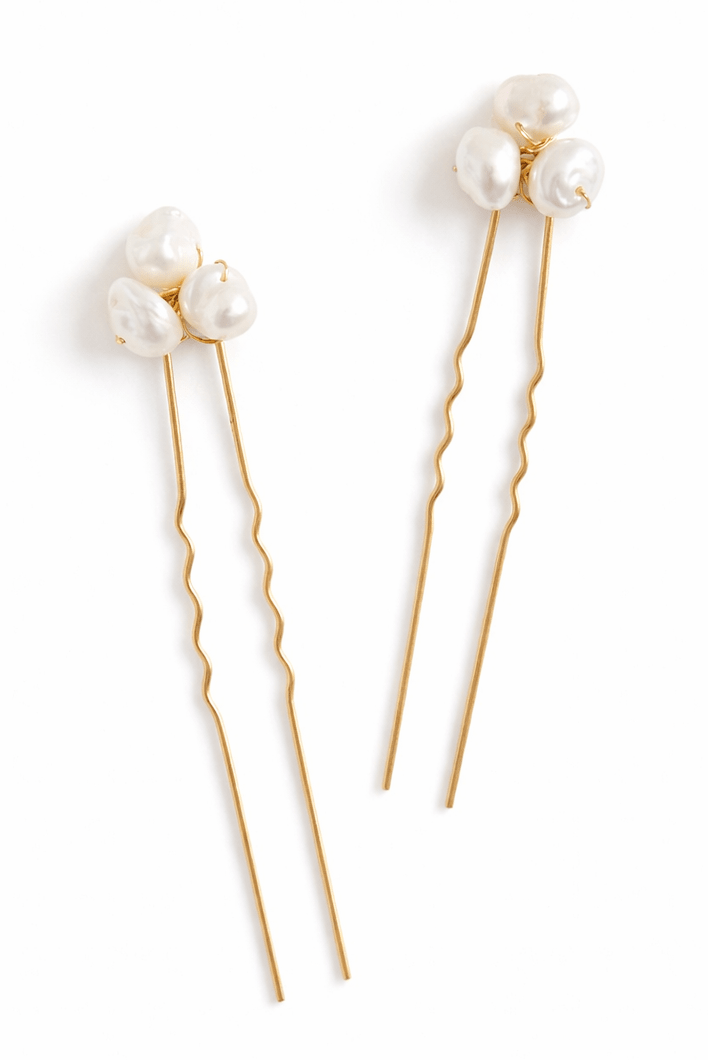 Gold Filipino freshwater pearl hairpin on a white background. Handmade freshwater pearl bridal accessories for Canada weddings.