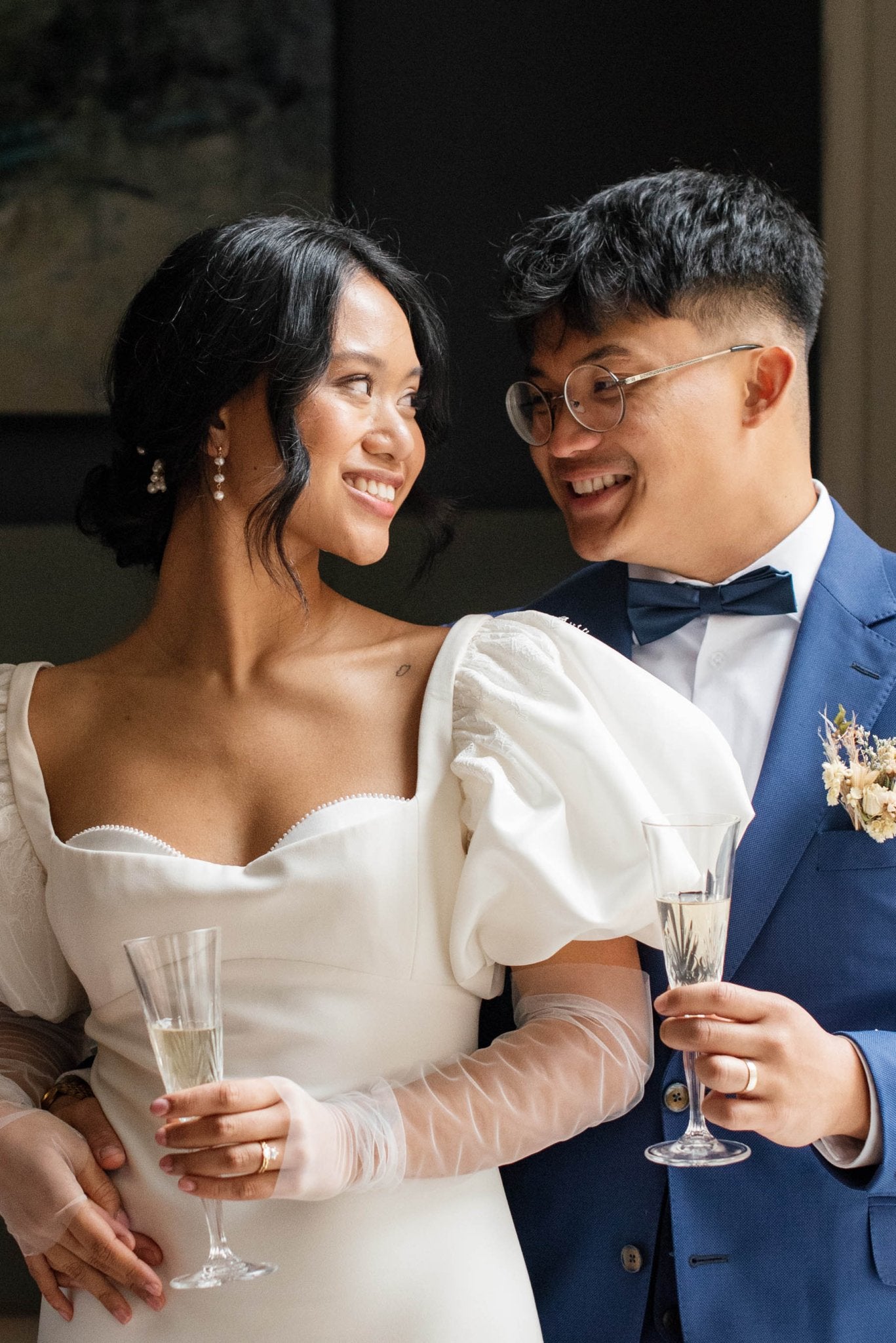 A happily couple just married celebrate with champagne; the bride glowing with her gold-filled drop down freshwater pearl studs. Bridal jewelry Canada. Pearl jewelry Canada. Pearl Bridal jewelry Canada. Gold-filled jewelry Canada. Canadian jewelry business. Organic pearl jewelry. Handmade Canadian jewelry.