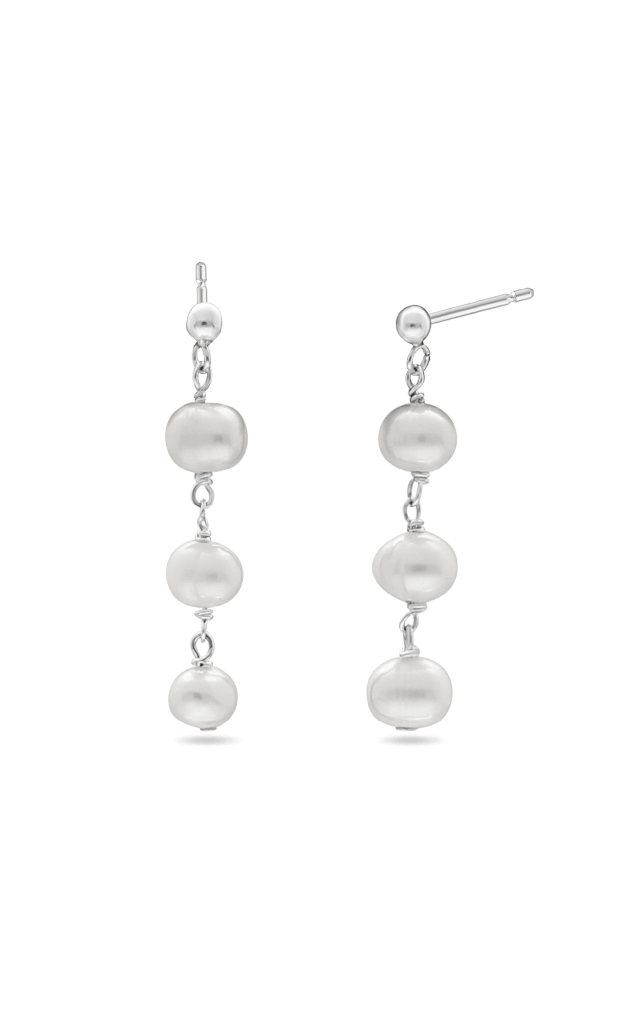 A pair of Sterling Silver freshwater pearl dangle earrings on white background. Pearl bridal earrings, silver wedding jewelry, & pearl wedding jewelry handmade by Canadian BIPOC wedding designer