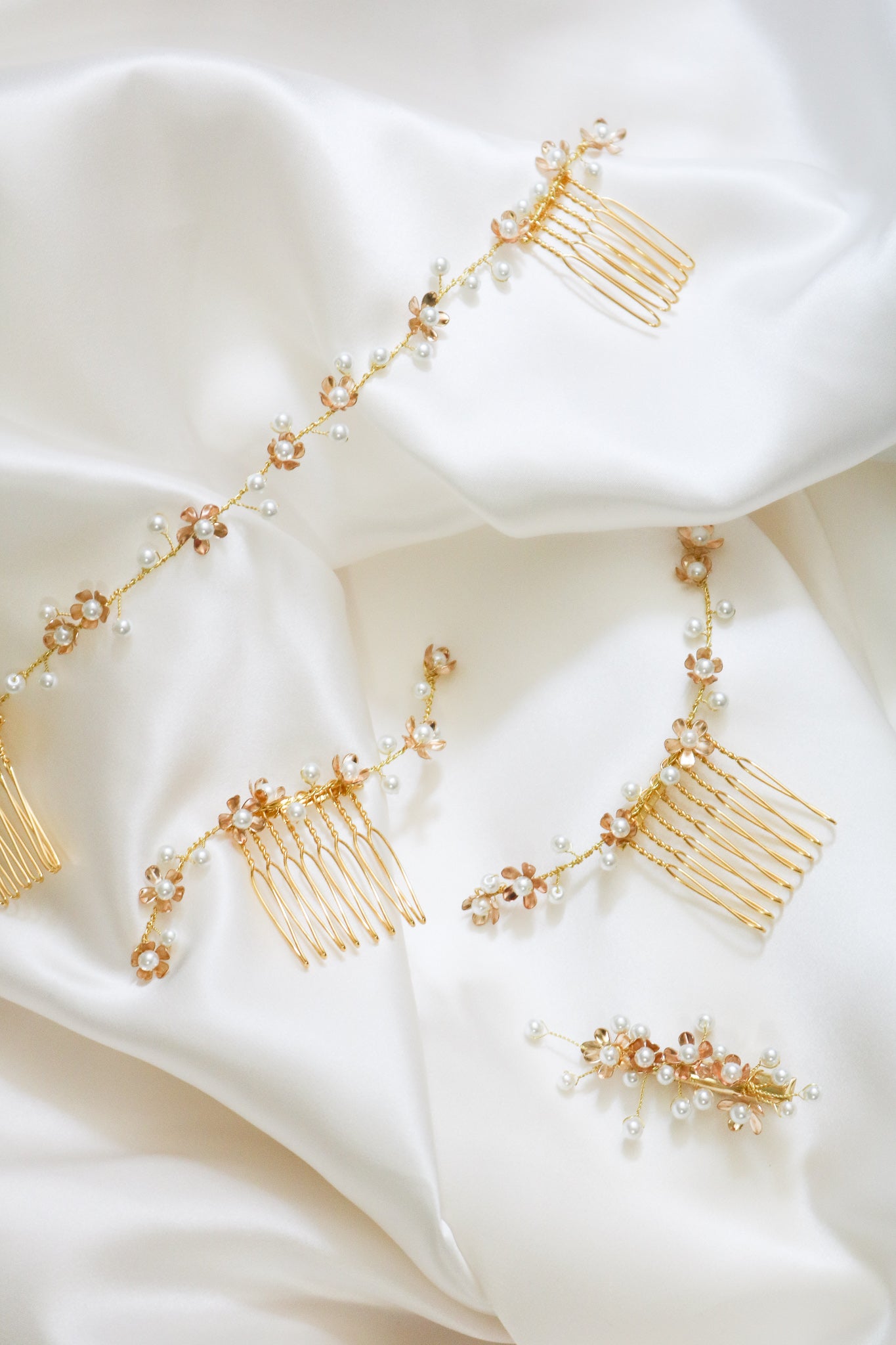 A set of 4 bridal hair accessories including two gold hair combs with freshwater pearls, one gold freshwater pearl hair barrette, and a bridal hairvine. Bridal Hair Accessories. Bridal Accessories. Canadian Bridal Accessories. Handmade Canadian Accessories. Canadian handmade Accessories. Canadian weddings. Wedding Canada. Organic pearl accessories. Pearl Bridal Hair Accessories. Pearl Bridal Accessories.