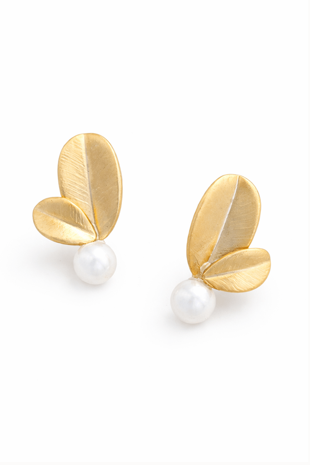 Gold leaf-shaped earrings with natural Philippine pearls on a white background. Handmade everyday jewelry & Canadian pearl jewelry by BIPOC jewelry designer