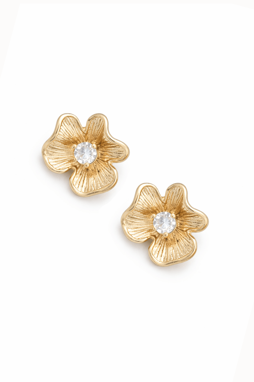 Gold flower-shaped earrings with crystal centers on a white background. Gold-filled earrings handmade in Canada by BIOC jewelry designer