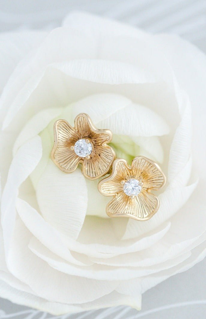 Gold filled flower earrings with central crystal sitting in a white rose. Everyday jewelry & minimalist bridal  jewelry handmade in Canada by BIPOC jewelry designer
