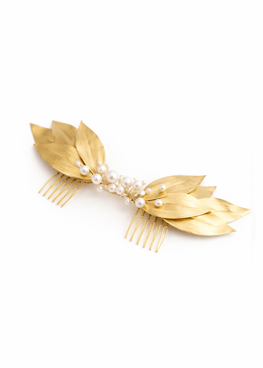 Gold bridal hair comb with leaf-like designs and freshwater pearls on a white background. Bridal hair accessories & Canadian bridal accessories handmade by BIPOC bridal designer