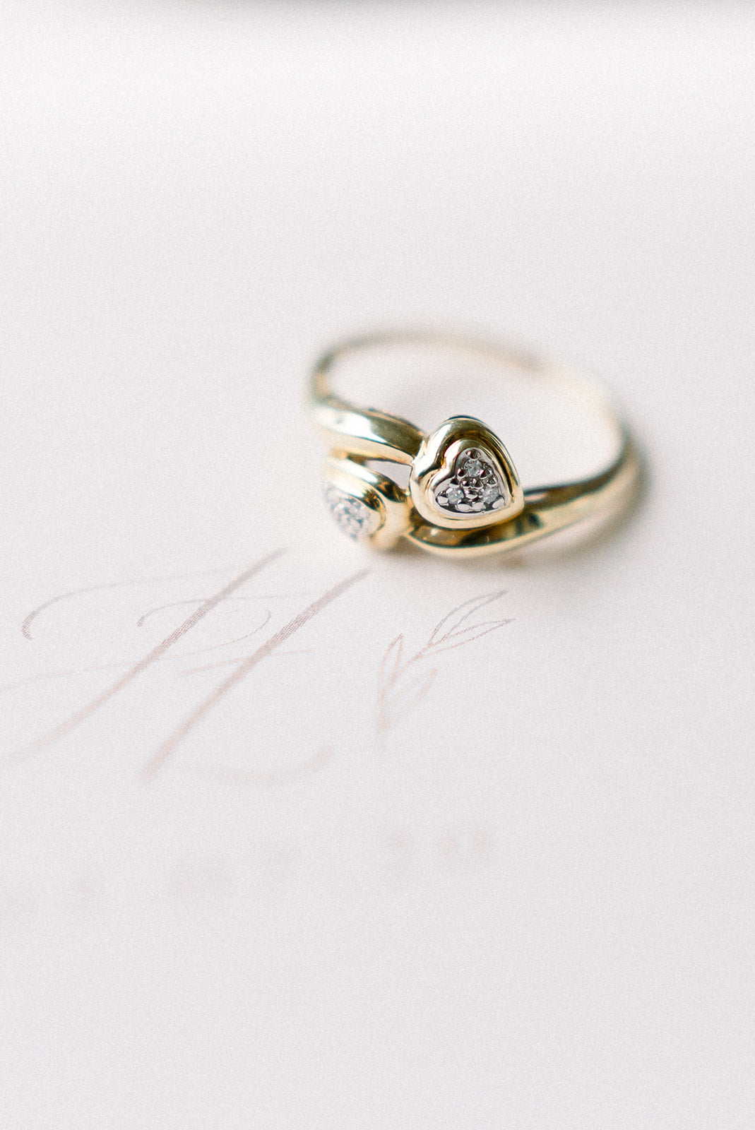 A 10k Gold & Platinum Double Diamond Heart Engagement Ring on a white background.