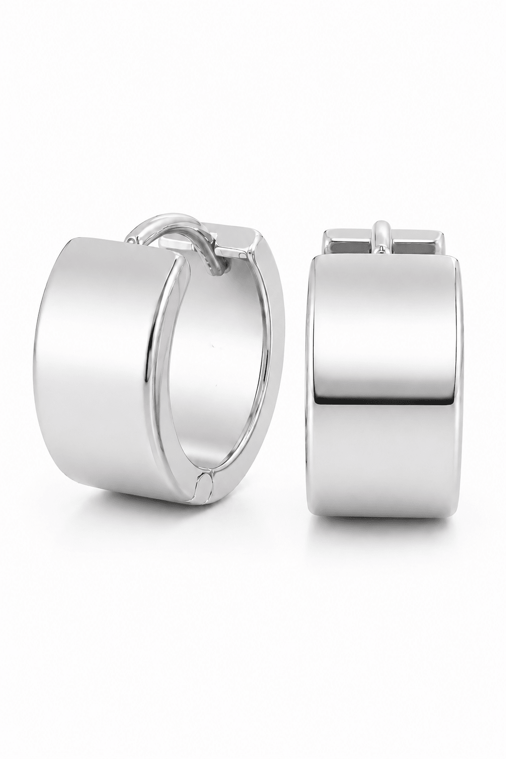 Pair of silver huggie style hoop earrings on a white background. Minimalist Jewelry, Canadian handmade jewelry, & everyday earrings by BIPOC jewelry designer