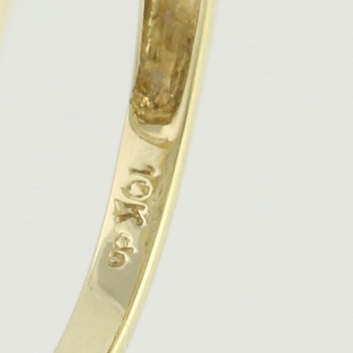 An extreme close up of the inside stamp for the Novah 10k Gold Vintage Engagement Ring. 