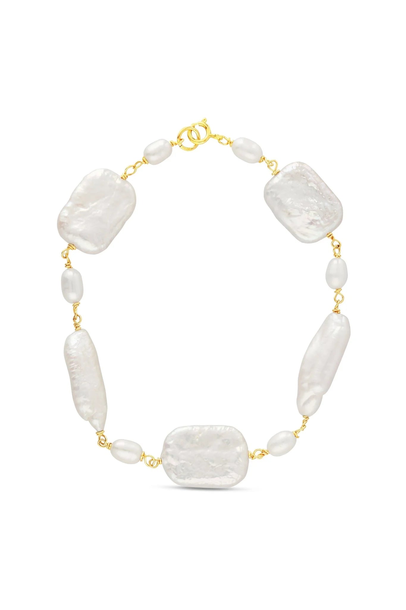 A bridal bracelet featuring a mosaic of freshwater pearls with gold filled hardware on white background. Handmade bridal jewelry, pearl wedding jewelry, & handmade bridal jewelry by Canadian BIPOC jewelry designer